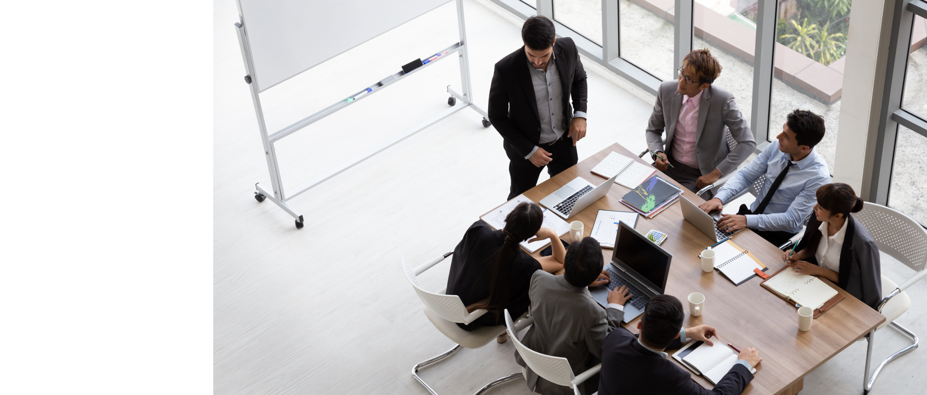 Hero banner with executives in a room