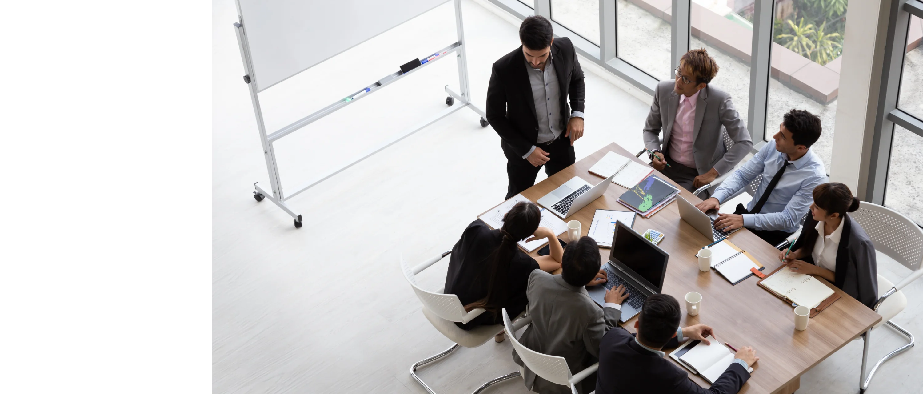 Hero banner with executives in a room